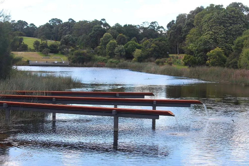 Pond with artistic water feature in Sydney Park — Shutterstock