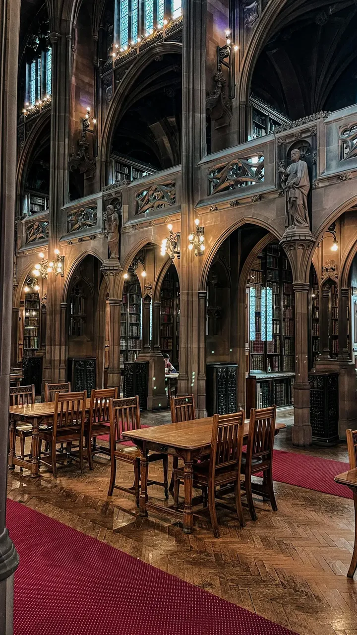 The John Rylands Library, showcasing its impressive neo-Gothic architecture and intricate stone carvings