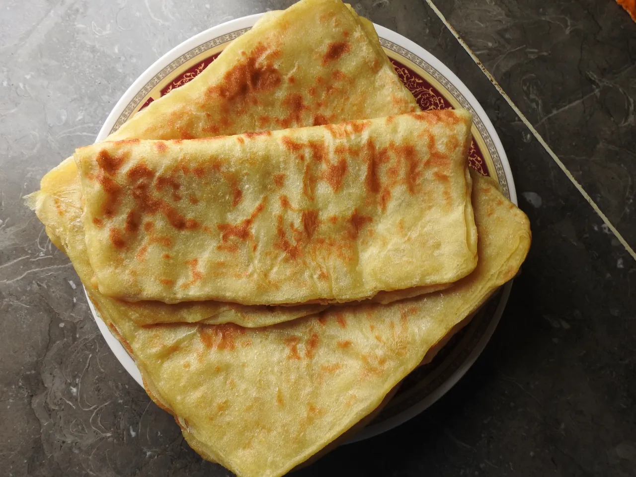 closeup of fresh baked Moroccan square pancakes called Rghaif or Msemen