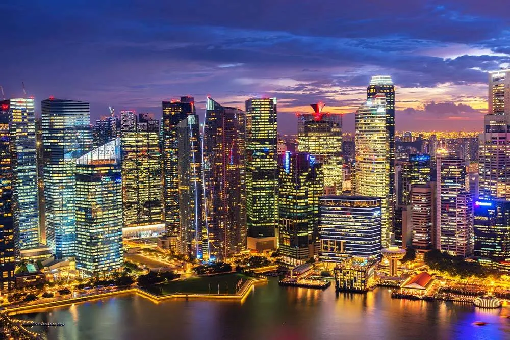 Skyscrapers in Singapore at night — Shutterstock