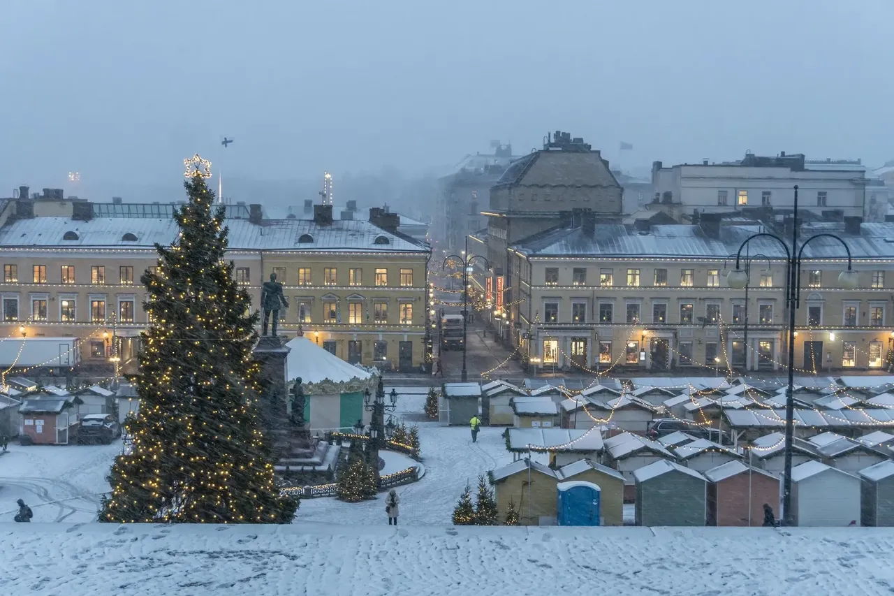 Charming Christmas market in Helsinki, Finland, featuring colorful stalls, a grand Christmas tree, and a festive atmosphere