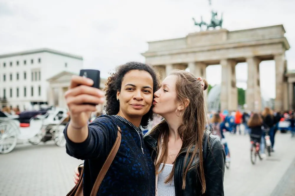 Same-sex couple taking selfie in Berlin — Getty Images