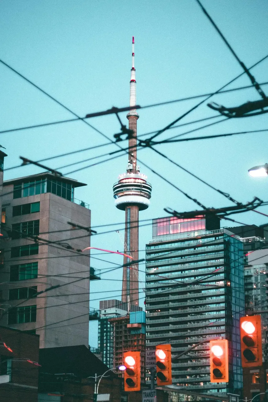 The iconic CN Tower, one of Toronto’s most famous landmarks, against a clear blue sky