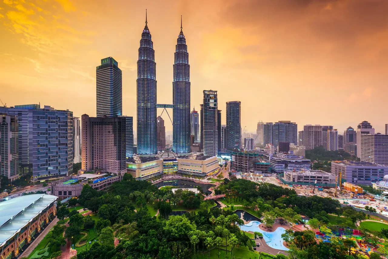 The majestic Petronas Towers stand above a city full of a heady mix of languages, cultures and incredible tasty street food — Shutterstock Top 10 family holiday ideas