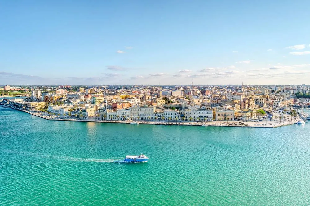 View over Brindisi from turquoise sea — Getty Images