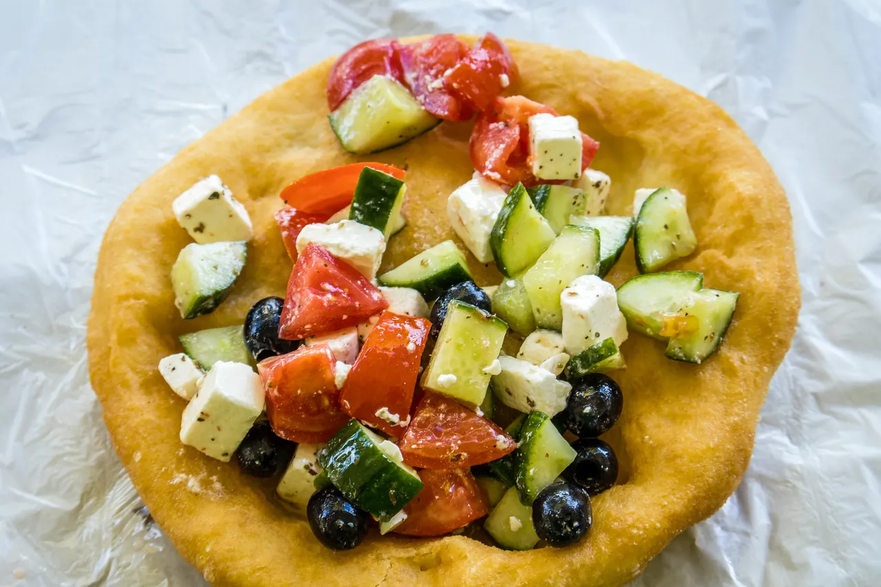 Langos with Greek salad on it, Budapest, Hungary