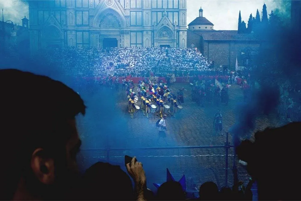 Blue smoke plumes over the proceedings at the “Florentine kicking game”