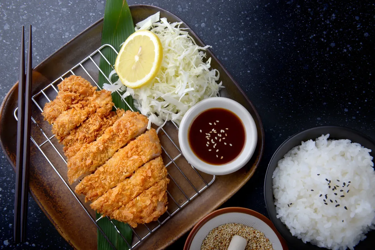 Tontsaku is something that won’t break the bank - fried pork served with shredded cabbage— Shutterstock