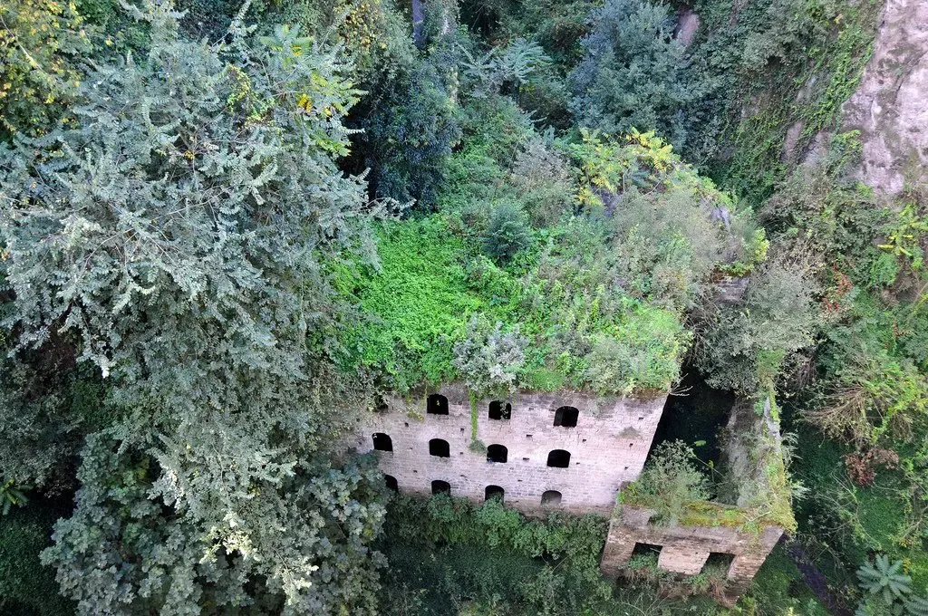 The valley is now home to the lush greenery that’s slowly eating into the huge stone factory complex— Dennis Jarvis / Flickr Italy cool weird classic Italy