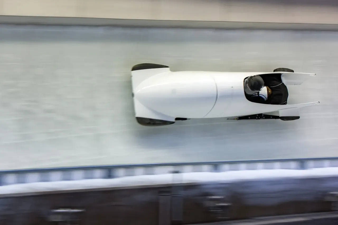 Bobsleigh in motion on track — Shutterstock