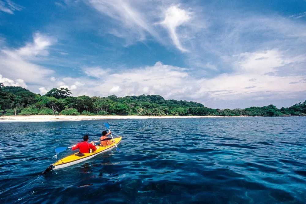 People sea kayaking in Indonesia — Getty Images