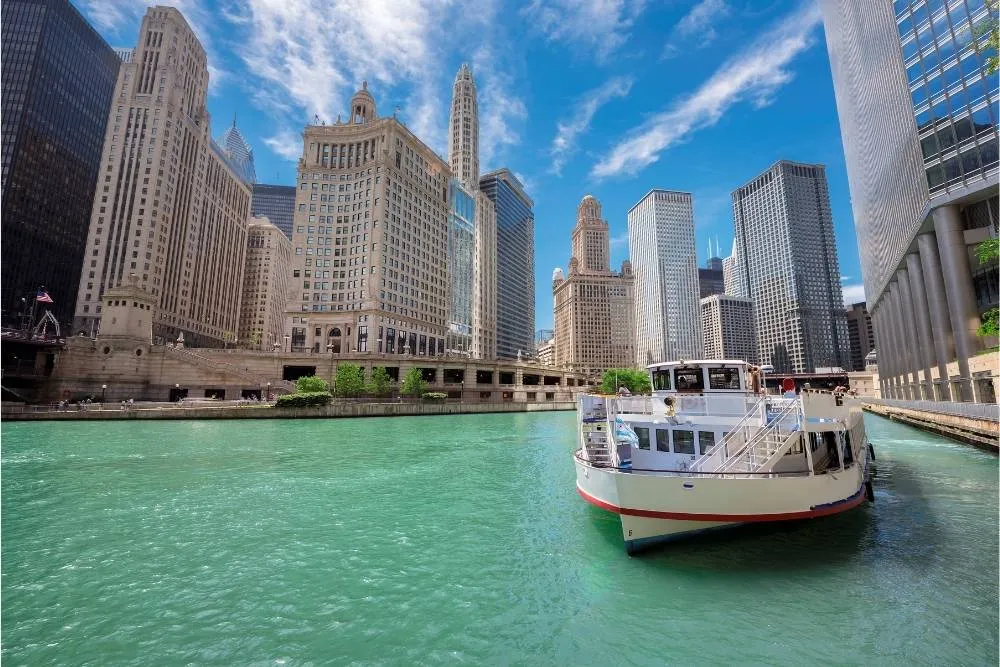 River cruise boat in Chicago with skyscrapers in the background — Shutterstock