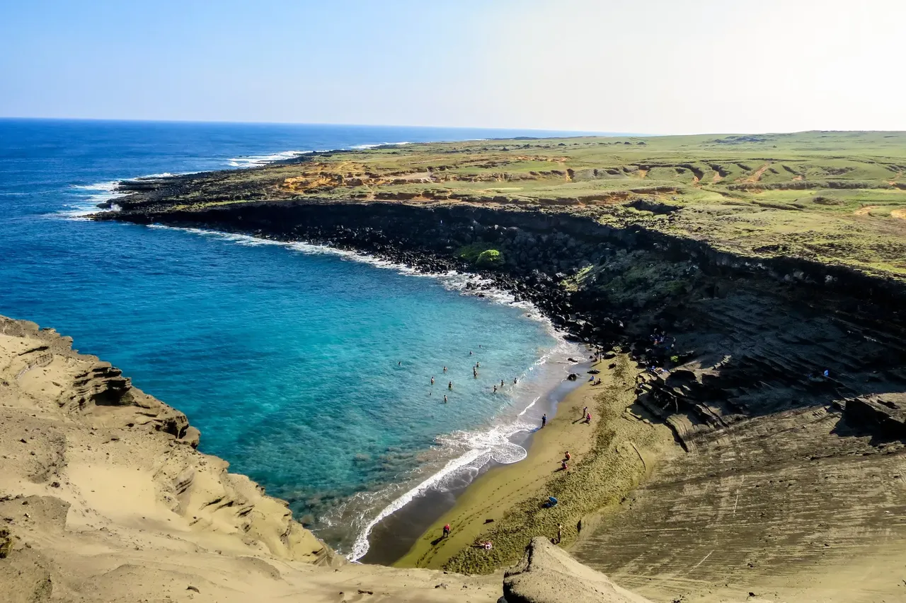 After a three mile hike along the cliffs, you end up on the beach… and it’s green — Shutterstock beaches 2018