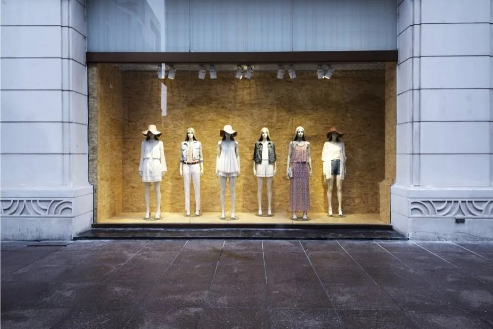 Female mannequins in a shop window — Shutterstock