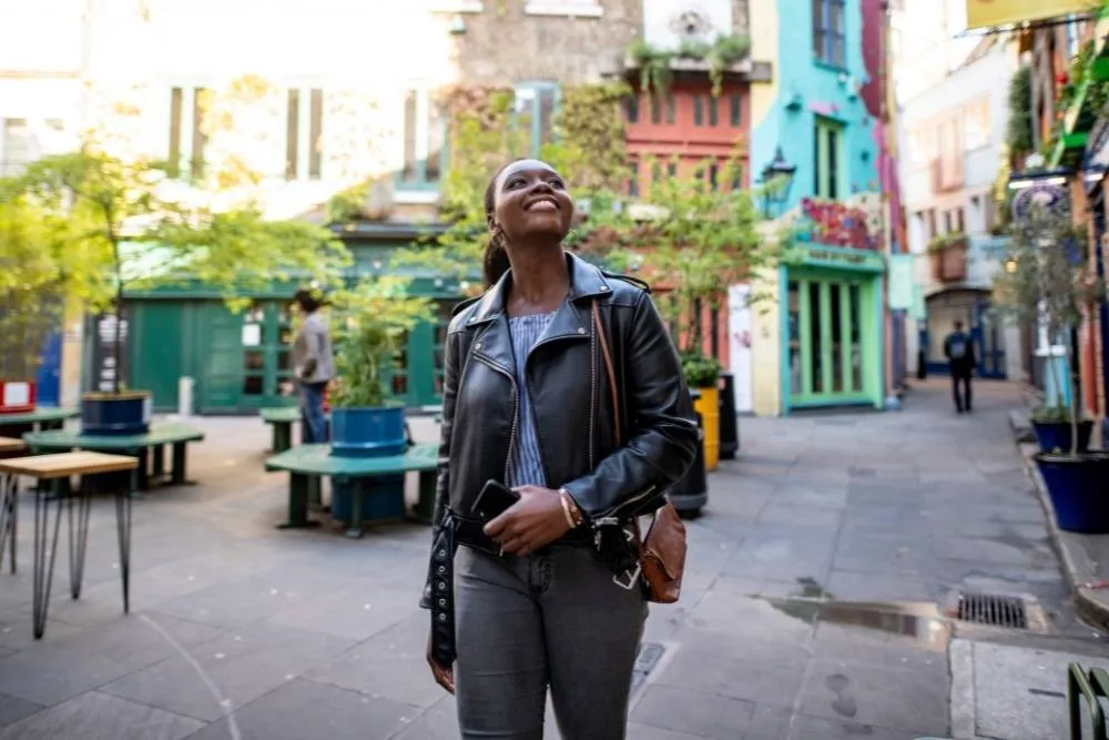 Woman exploring the streets of Stoke Newington — iStock