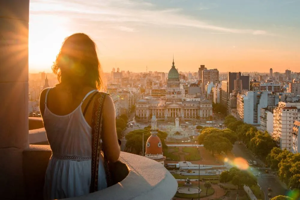 Women looking over the center of Buenos Aires at sunset — Getty Images