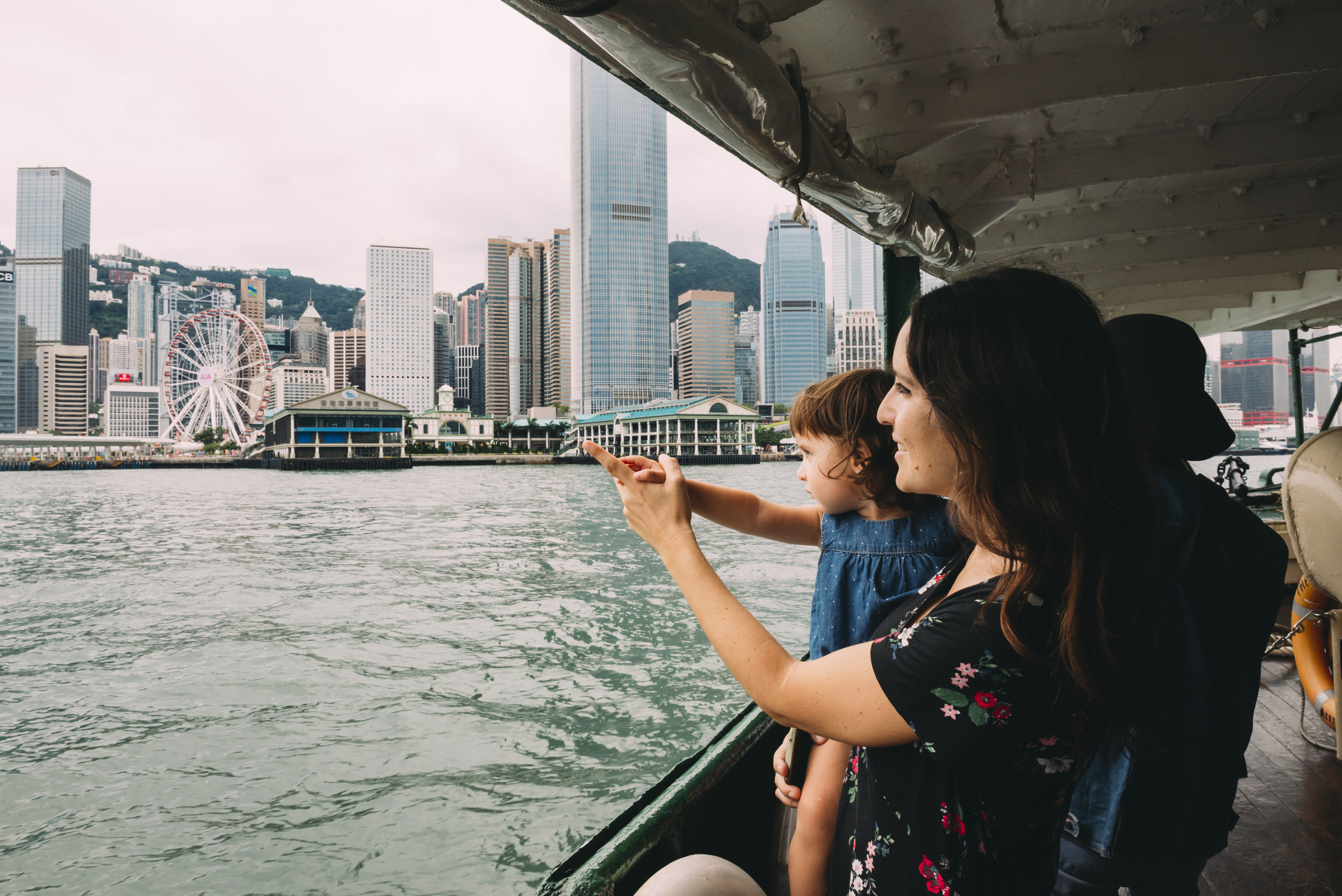 Mother with little daughter on a boat to Hong Kong